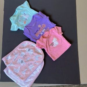 Three newborn onesies, and two burp cloths